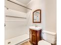 Updated bathroom with a vanity and a shower featuring white tiling and a modern shower head at 122 Quinn Ave, Gastonia, NC 28054