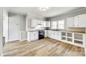 Spacious kitchen featuring white cabinets, wood countertops, and modern appliances at 122 Quinn Ave, Gastonia, NC 28054