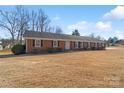 Brick ranch house with a wide front yard and mature trees at 1504 Hallmark Dr, Rock Hill, SC 29730