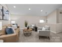 Cozy upstairs living room with comfortable seating and neutral color palette at 203 Riverview Ter, Clover, SC 29710