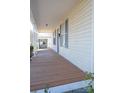 View of a spacious front porch with wooden flooring at 303 Vance Ave, Salisbury, NC 28144