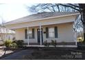 Charming house with a front porch and well-maintained landscaping at 303 Vance Ave, Salisbury, NC 28144