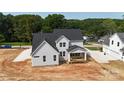 Aerial view of a two-story new construction home with covered porch at 4251 Candlewood Dr, Sherrills Ford, NC 28673