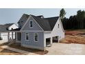 New construction two-story home with gray siding, attached two-car garage and brick foundation at 4251 Candlewood Dr, Sherrills Ford, NC 28673