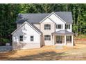 Stunning two-story home with a dark roof, brick exterior and light-colored siding at 4251 Candlewood Dr, Sherrills Ford, NC 28673