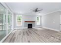 Spacious living room with hardwood floors, fireplace, and sliding doors to patio at 4251 Candlewood Dr, Sherrills Ford, NC 28673