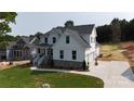 Charming two-story home with white siding, stone accents, an attached garage, and landscaped lawn at 4257 Candlewood Dr # 7, Sherrills Ford, NC 28673