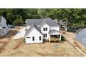 Bright two-story home with white siding, gabled roof, and a charming rear deck for relaxing at 4257 Candlewood Dr # 7, Sherrills Ford, NC 28673