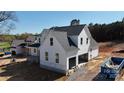 A new construction home showing white board and batten siding and an attached two-car garage at 4257 Candlewood Dr # 7, Sherrills Ford, NC 28673