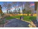 Spacious backyard with patio and wooden fence at 5410 Seacroft Rd, Charlotte, NC 28210