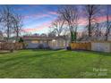 Large backyard with grassy area, shed, and detached garage at 5410 Seacroft Rd, Charlotte, NC 28210