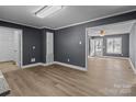 Open dining area with hardwood floors and access to kitchen at 700 Leonard Ave, Kannapolis, NC 28081