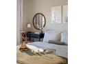 Bright bedroom with a comfortable bed and a wooden desk at 8018 Elevate Ct, Charlotte, NC 28205