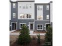 Modern townhouses with gray and white exterior at 8018 Elevate Ct, Charlotte, NC 28205