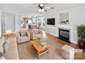 Spacious living room with fireplace and hardwood floors at 8035 Bristle Ln, Charlotte, NC 28214