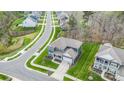 Aerial view of a neighborhood with a two-story house in the center at 8903 Ansley Park Pl, Huntersville, NC 28078