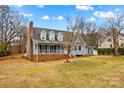 Charming blue two-story home featuring a welcoming front porch and dormer windows at 111 Wheaton Ct, Salisbury, NC 28147