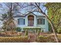 Charming light blue brick home with manicured landscaping and brick walkway at 1204 Buchanan St, Charlotte, NC 28203