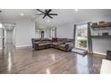 Spacious living room with hardwood floors and sectional sofa at 2222 Fox Hunt Dr, Monroe, NC 28110