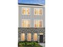 Two-story townhome with gray siding and brick accents at 5004 Rill Ct # 37, Charlotte, NC 28262