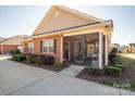 Brick home with screened porch and landscaping at 8176 Viscount Ct, Denver, NC 28037