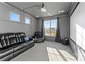 Home theater with projector, screen, and comfortable seating at 10045 Carousel Corral Dr, Midland, NC 28107