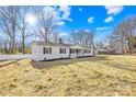 Exterior view of home with green yard, showcasing the roofline, windows, and neighborhood at 1006 Woodside Dr, Kings Mountain, NC 28086