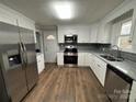 Modern kitchen with stainless steel appliances and granite countertops at 107 Meadow Ne Ave # 7, Concord, NC 28025