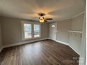 Bright living room featuring hardwood floors and a fireplace at 107 Meadow Ne Ave # 7, Concord, NC 28025