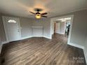 Hardwood floors, neutral walls, and views into dining room and kitchen at 107 Meadow Ne Ave # 7, Concord, NC 28025