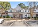 Two-story townhome with gray accents and landscaping at 12307 Bluestem Ln, Charlotte, NC 28277