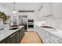 Bright kitchen boasts a large island, stainless steel appliances, and ample counter space at 130 Cherokee Rd # 104, Charlotte, NC 28207