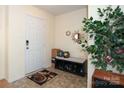 Front entry with bench, shoe storage, and decorative mirror at 185 Altondale Dr, Statesville, NC 28625