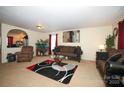 Living room with couches, coffee table, and a fish tank at 185 Altondale Dr, Statesville, NC 28625