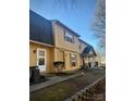 Two-story yellow home with gray roof, multiple units shown at 3959 Briarhill Dr, Charlotte, NC 28215