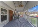 Inviting porch with a classic porch swing and ceiling fan, perfect for relaxing outdoors at 443 Picadilly Ln, Troutman, NC 28166
