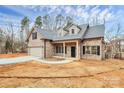 Stunning brick home with a two-car garage, covered entrance, and well-placed windows at 5230 Club View Dr, Concord, NC 28025