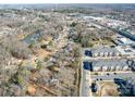 Wide aerial view of neighborhood including a lake at 539 Dawn Cir, Charlotte, NC 28213