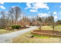 Charming home with a long driveway and landscaping at 8115 Kingsland Dr, Waxhaw, NC 28173