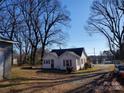 White house with mature trees and a large yard at 903 Belmont Mount Holly Rd, Belmont, NC 28012