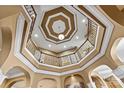 Dramatic view of the foyer's detailed ceiling, wrought iron railing, and architectural design at 103 Glenholden Ln, Mooresville, NC 28115