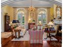 Spacious living room with hardwood floors and multiple windows at 104 Lazenby Dr, Fort Mill, SC 29715