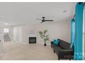 Living room features hardwood floors, fireplace, and large windows at 10841 Twisted Bark Ln, Charlotte, NC 28213