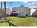 Spacious backyard with screened porch and fire pit at 114 Runningdeer Dr, Mooresville, NC 28117