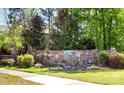 Stone sign at the entrance to Chapel Cove, a community surrounded by lush greenery at 11519 Sweet Birch Ln, Charlotte, NC 28278