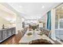 Elegant dining room with a large table and chairs, adjacent to the kitchen at 11519 Sweet Birch Ln, Charlotte, NC 28278