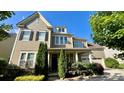 Attractive two-story home features a two-car garage, manicured landscaping, and a covered front porch at 11519 Sweet Birch Ln, Charlotte, NC 28278