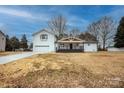 Charming white two-story home with a covered porch and a large front yard at 139 Elysian Dr, Mooresville, NC 28117