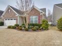 Brick home with two-car garage and manicured landscaping at 156 Carmen Way # 70, Lancaster, SC 29720