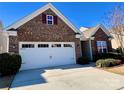 Spacious two-car garage with brick facade and a concrete driveway at 156 Carmen Way, Lancaster, SC 29720